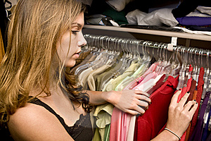 woman looking through closet